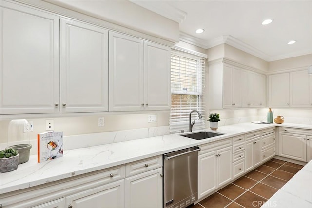 kitchen with white cabinets, dark tile patterned flooring, a sink, crown molding, and stainless steel dishwasher