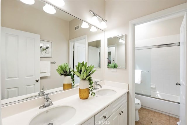 bathroom with tile patterned flooring, visible vents, a sink, and toilet