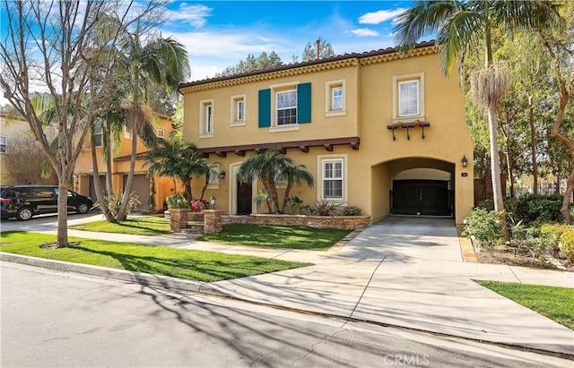 mediterranean / spanish-style house featuring stucco siding, an attached garage, concrete driveway, and a tile roof