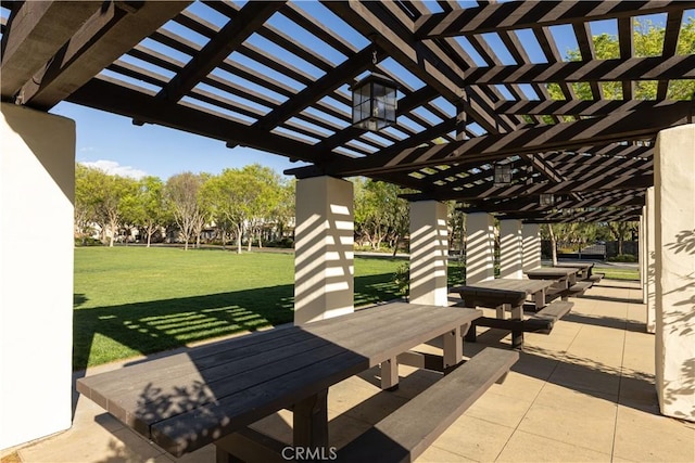 view of patio / terrace featuring a pergola and outdoor dining area