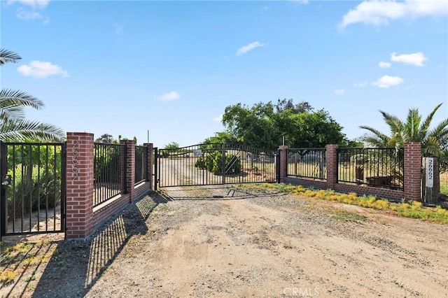 view of gate featuring fence