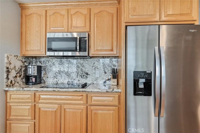 kitchen featuring appliances with stainless steel finishes, backsplash, and light brown cabinets