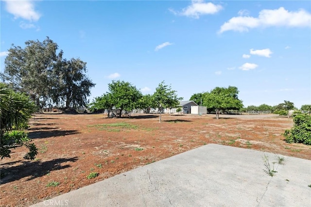 view of yard with a patio area and a rural view