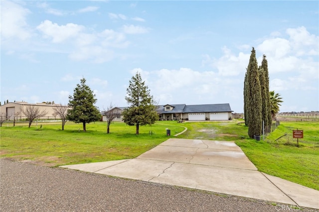 view of front facade with an attached garage, driveway, and a front yard