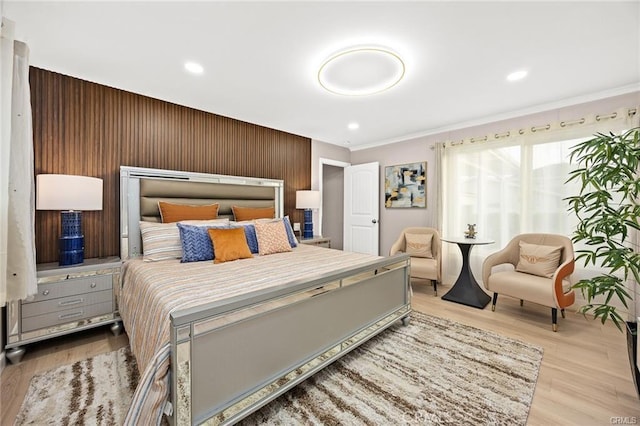 bedroom featuring wood finished floors and recessed lighting