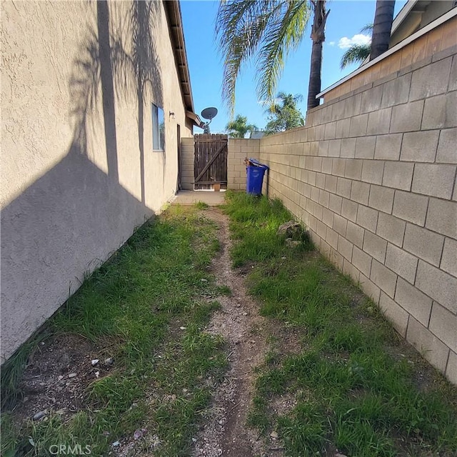 view of yard featuring a gate and fence