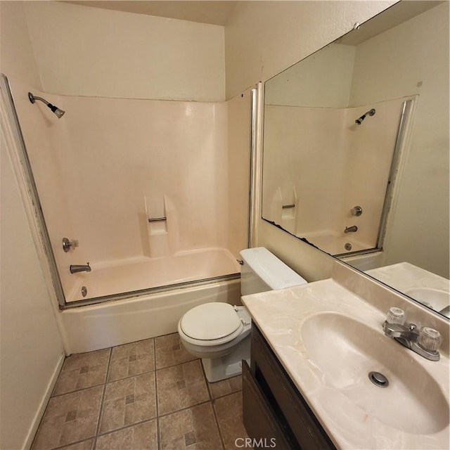 bathroom featuring shower / washtub combination, baseboards, vanity, and toilet