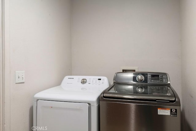 washroom featuring separate washer and dryer