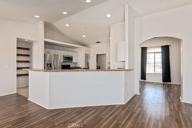 kitchen with light stone countertops, recessed lighting, stainless steel appliances, dark wood-type flooring, and white cabinets