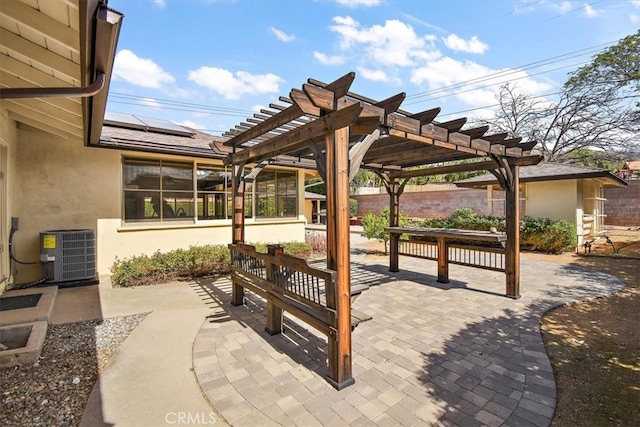 view of patio featuring a pergola and central AC unit