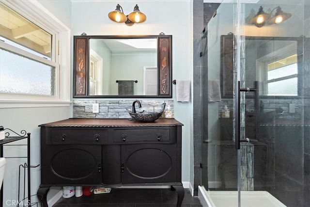 bathroom featuring a shower stall and vanity