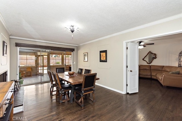 dining room featuring a textured ceiling, ornamental molding, wood finished floors, and baseboards