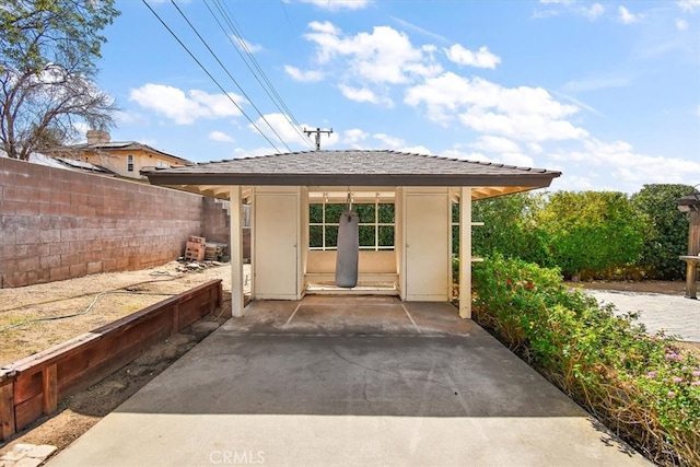 exterior space featuring fence, a patio, and stucco siding