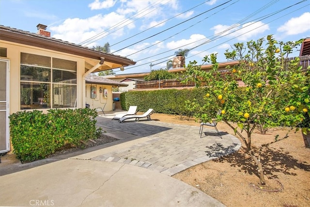 view of patio / terrace featuring fence