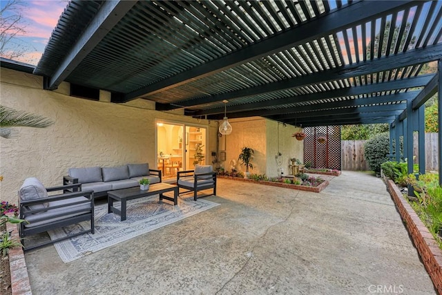 view of patio featuring an outdoor hangout area, fence, and a pergola