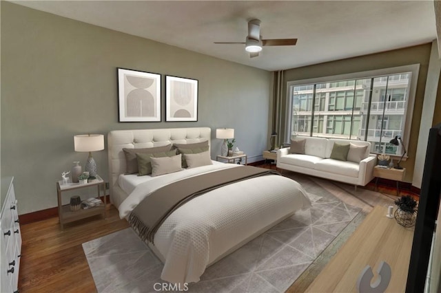 bedroom featuring ceiling fan, wood finished floors, and baseboards