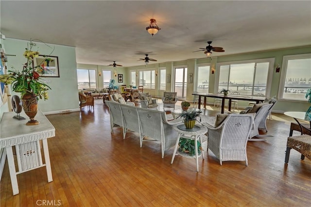 living room featuring hardwood / wood-style floors and baseboards