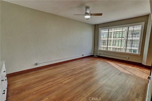 360 W Ocean Blvd Unit 404, Long Beach, CA 90802 - spare room featuring wood finished floors and ceiling fan