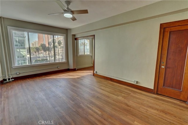 360 W Ocean Blvd Unit 404, Long Beach, CA 90802 - empty room featuring wood finished floors and ceiling fan