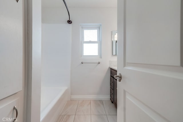 full bathroom with baseboards and vanity