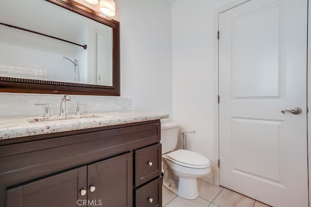 full bathroom featuring toilet, tile patterned flooring, vanity, and decorative backsplash