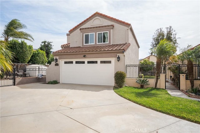 mediterranean / spanish house with driveway, a tiled roof, a gate, fence, and stucco siding