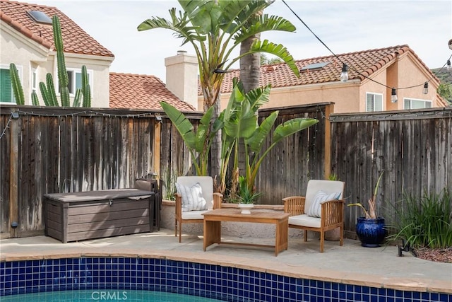 exterior space featuring a fenced backyard and a fenced in pool