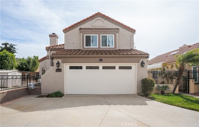 mediterranean / spanish-style house featuring concrete driveway, fence, a tiled roof, and stucco siding