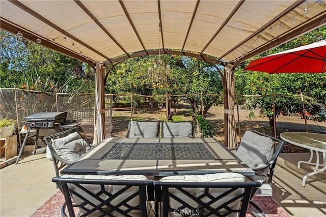 view of patio / terrace with fence and a pergola