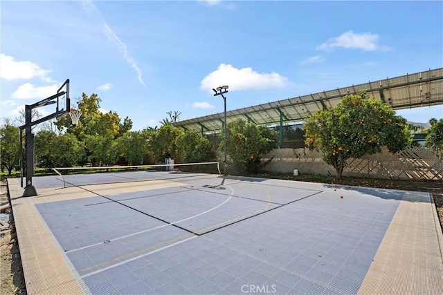 view of sport court featuring community basketball court and fence