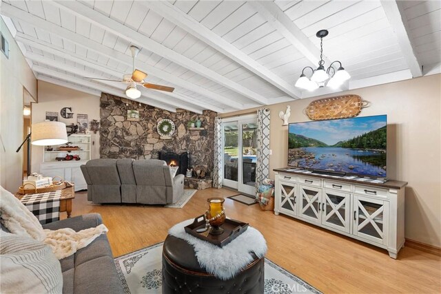 living room with a fireplace, lofted ceiling with beams, light wood-style floors, wood ceiling, and ceiling fan with notable chandelier