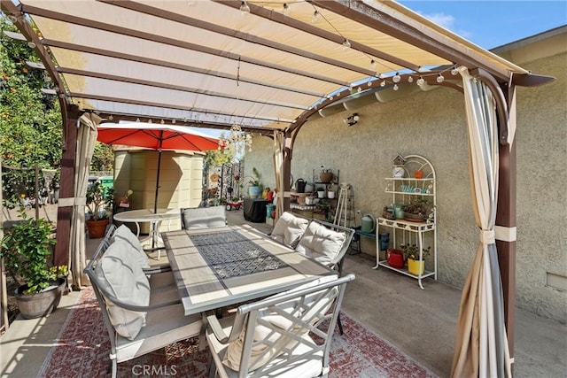 view of patio with outdoor lounge area and a pergola