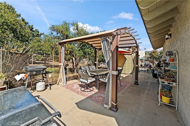 view of patio with fence, grilling area, a pergola, and outdoor dining space