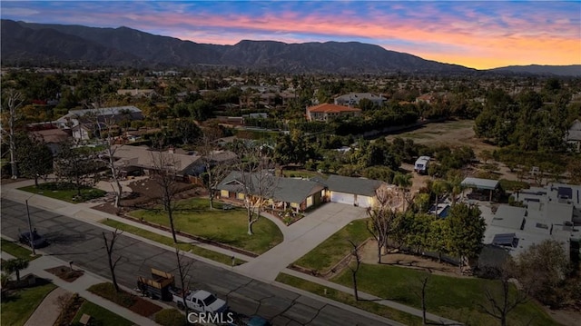 aerial view at dusk with a mountain view