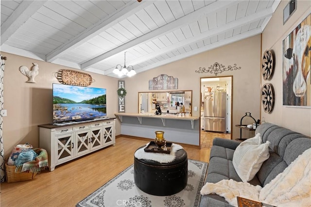 living room featuring vaulted ceiling with beams, a chandelier, light wood-style flooring, wood ceiling, and visible vents