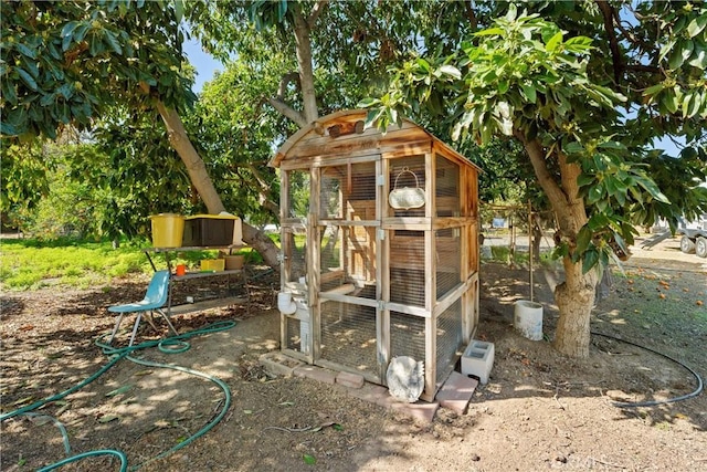 view of play area with an outbuilding and exterior structure