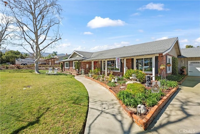 ranch-style home featuring a garage, a front yard, board and batten siding, and brick siding