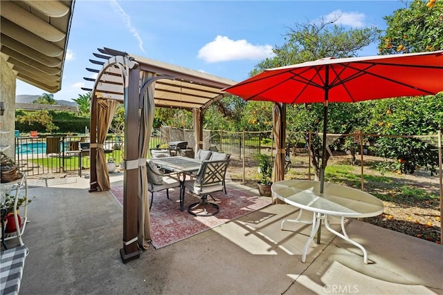 view of patio / terrace with outdoor dining area, a fenced backyard, and a pergola