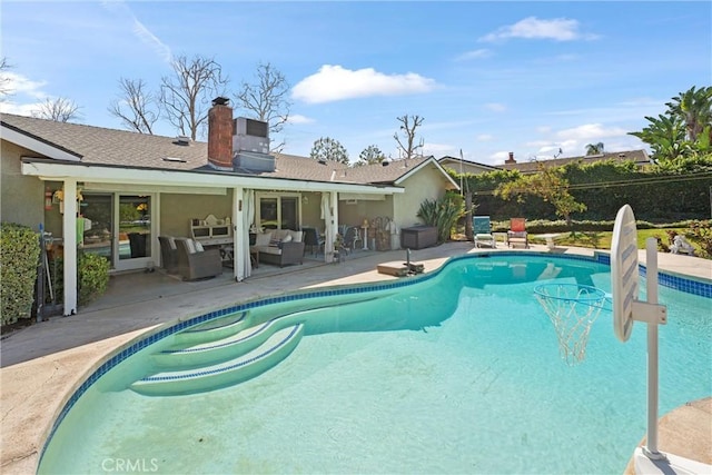 view of pool with a patio area, outdoor lounge area, and a fenced in pool