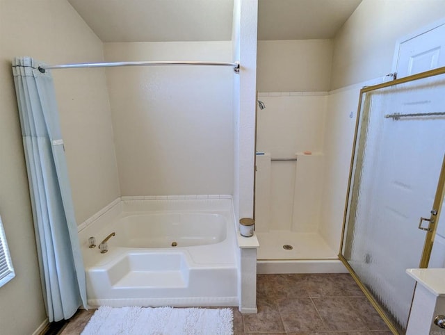 full bath with tile patterned flooring, a shower stall, and a bath