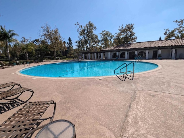 pool with a patio area