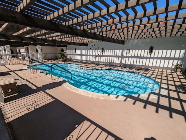 view of pool with a fenced in pool, a patio area, fence, and a pergola