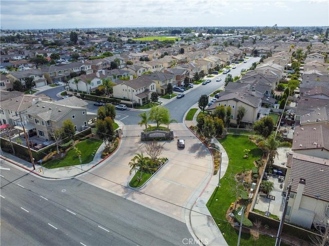 birds eye view of property with a residential view