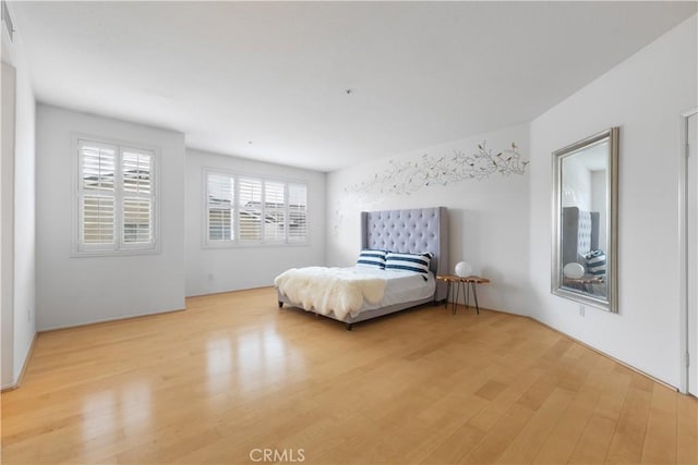 unfurnished bedroom with light wood-style floors