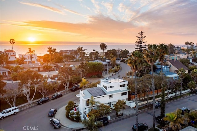 aerial view with a residential view and a water view