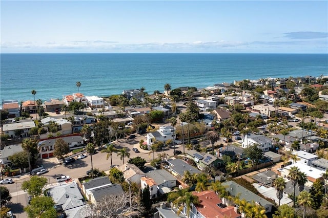 birds eye view of property with a water view and a residential view