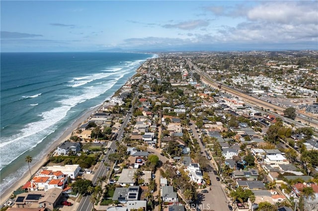 aerial view featuring a view of the beach and a water view