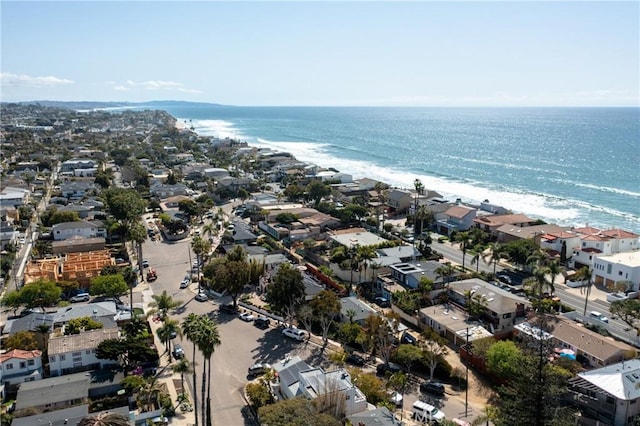 bird's eye view featuring a view of the beach and a water view