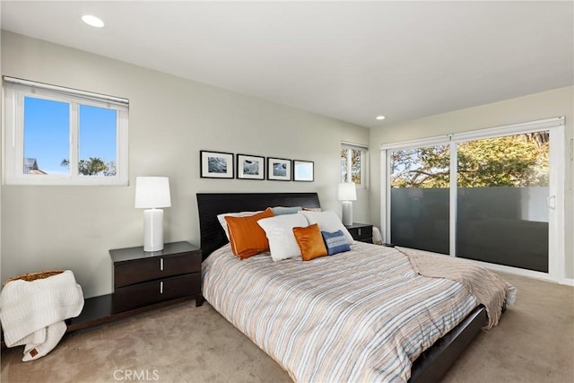 bedroom with light carpet and recessed lighting