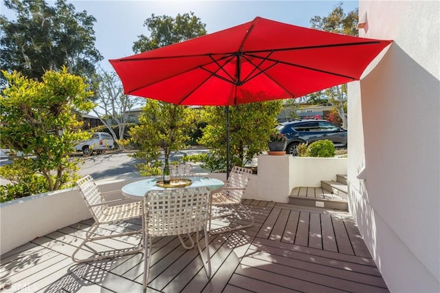 deck featuring outdoor dining area